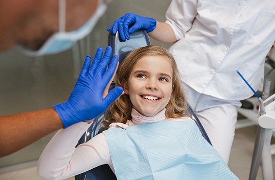 Girl high-fiving her dentist