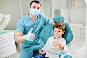 a child smiling during a dental visit 